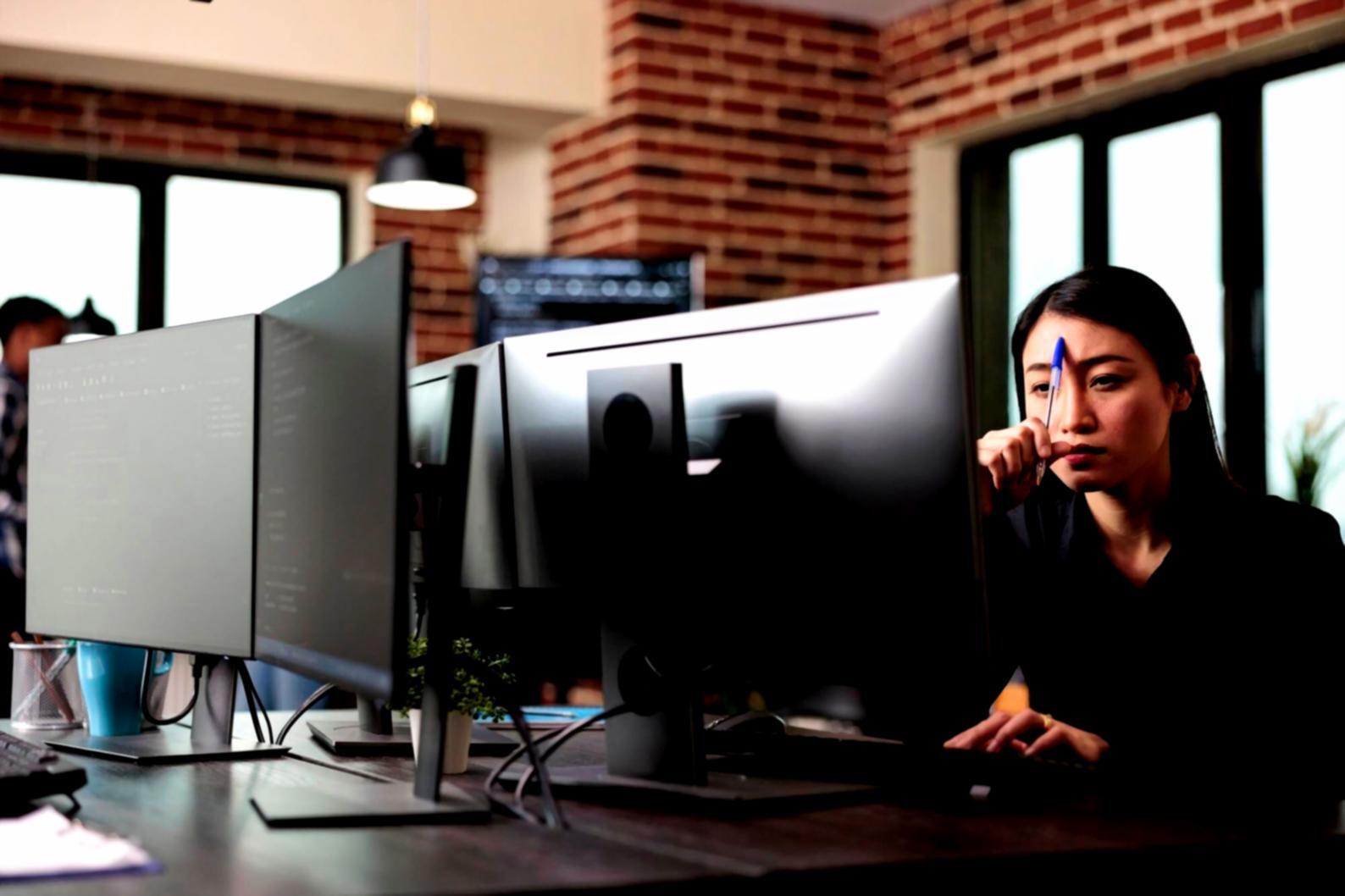 Students collaborating on UI design projects during workshop session